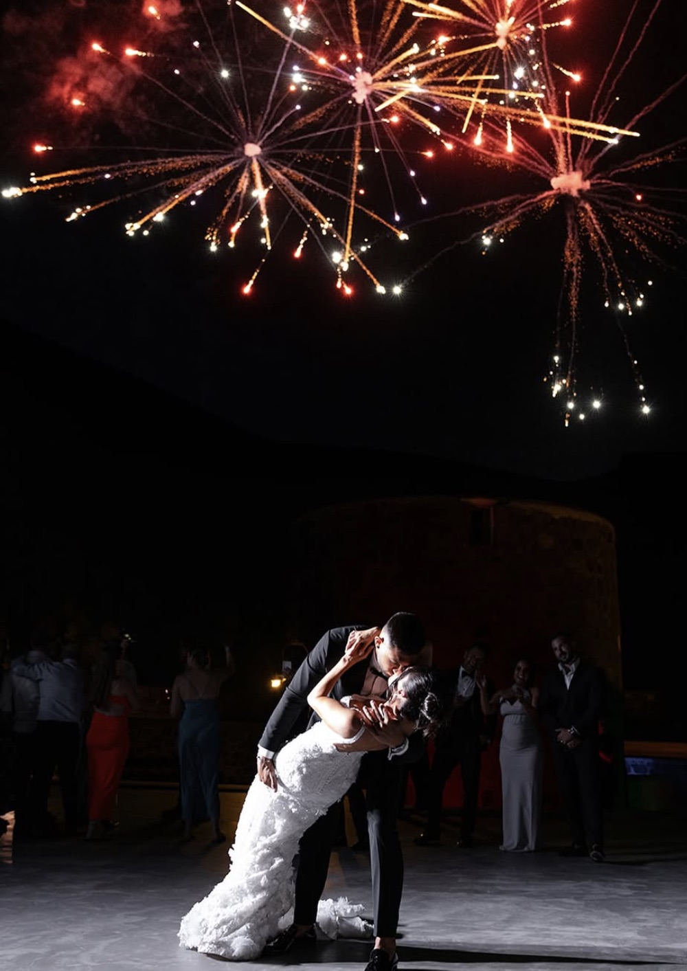 Aerial fireworks above a couple mid dance