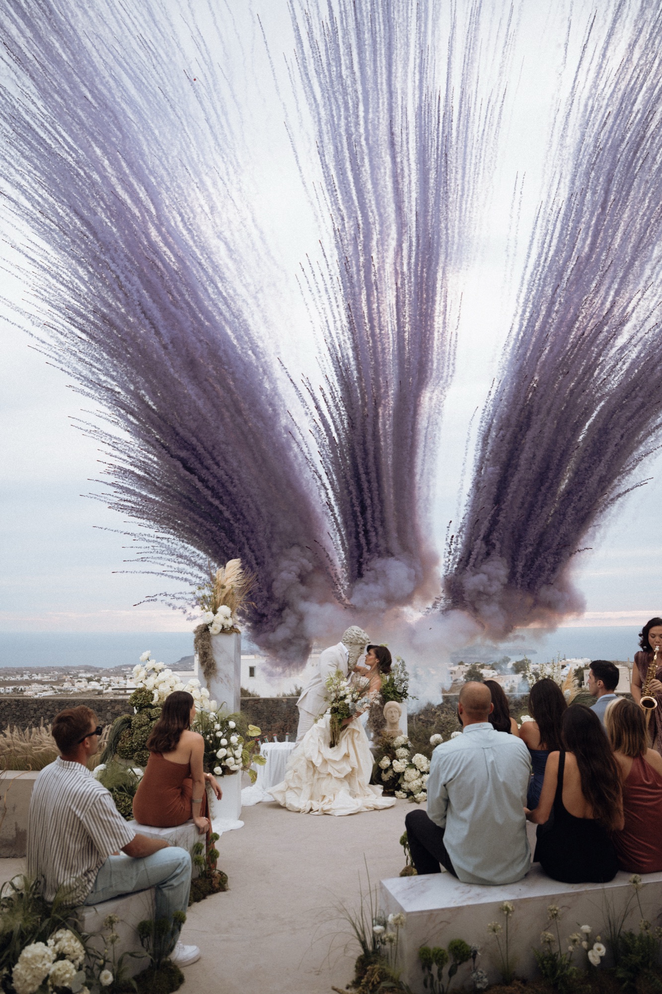 Violet smoke rising over a caldera ceremony